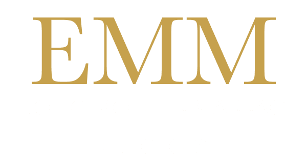 Logo for EMM: large gold letters 'EMM' with the words 'EROTIC MODELS MASSAGE' and a 'DIRECTORY' line below, on a dark background.